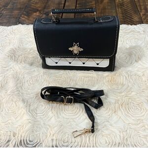 Elegant Black and White Crossbody Bag with Bee Detail
